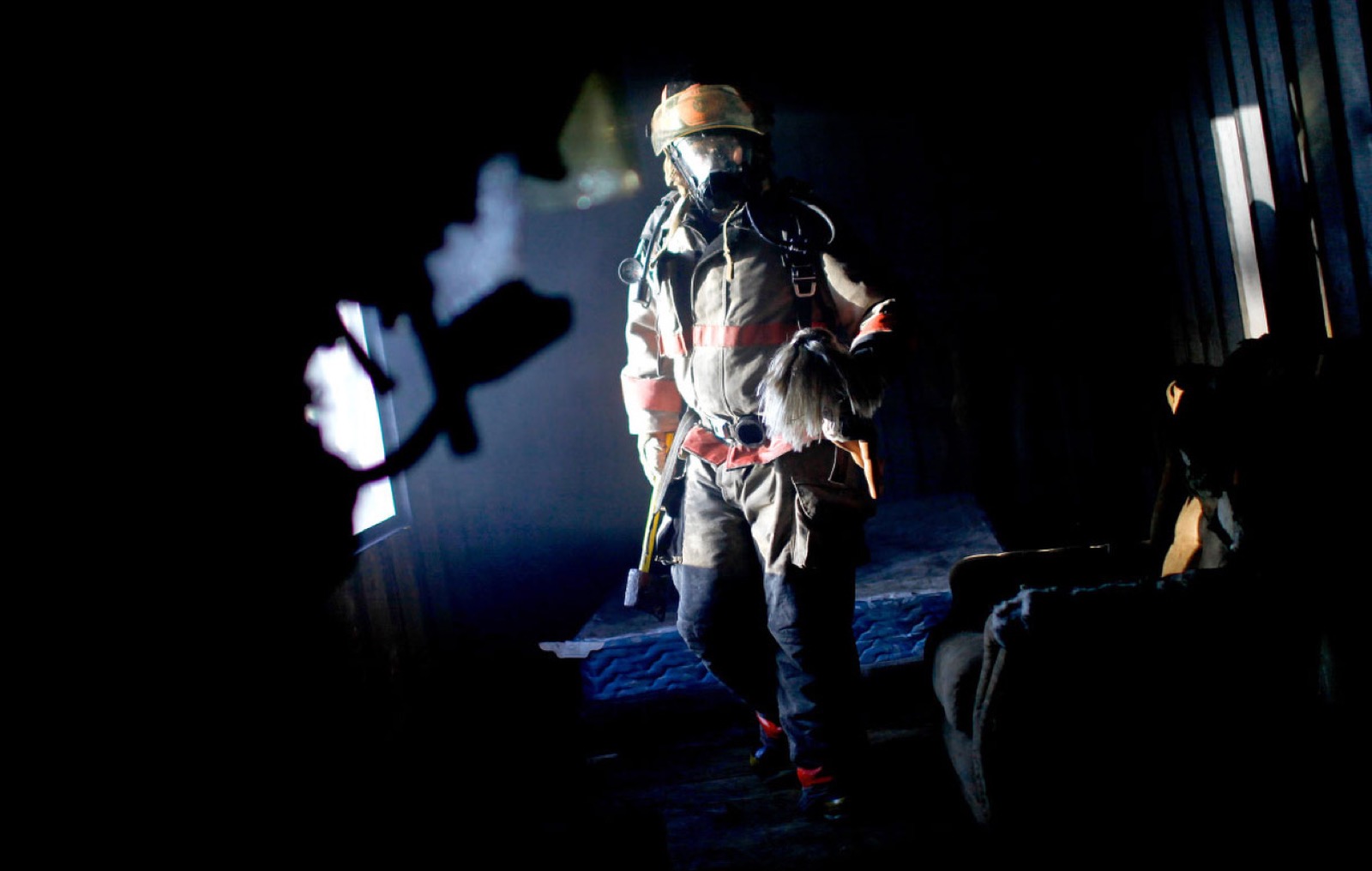 Firefighter carrying a child to safety